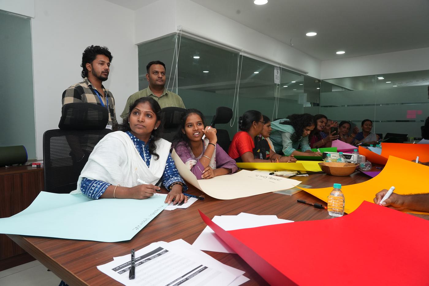 Women listening attentively during an Edstellar Foundation training session