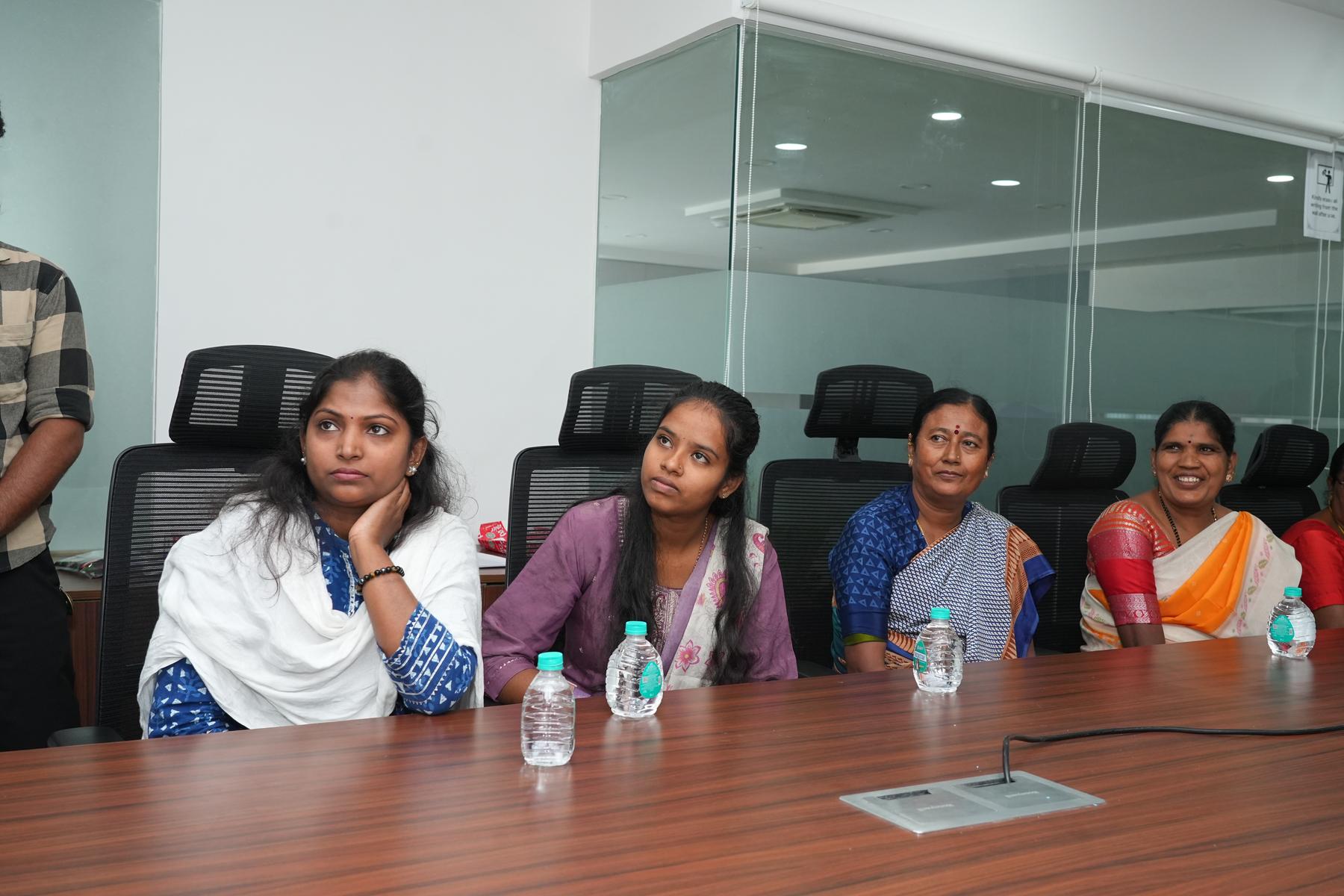 Group photo of Edstellar Foundation training participants, women in sarees, men in uniforms, together after a session